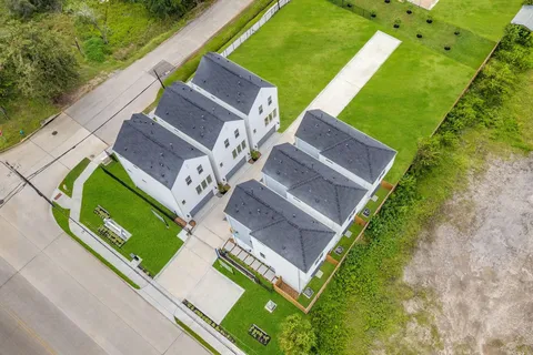 an aerial view of a house with a garden