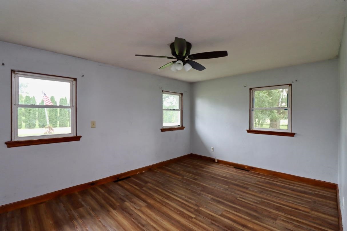 15262 Russellville Road Capron, IL 61012 - Photo 6 of 11 a view of empty room with wooden floor and fan