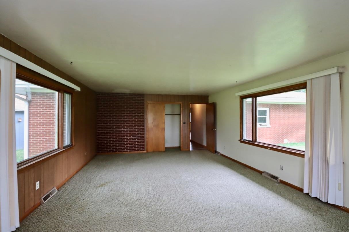15262 Russellville Road Capron, IL 61012 - Photo 7 of 11 an empty room with a window and closet