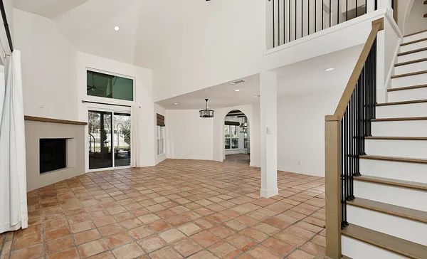 a view of a livingroom with wooden floor and fireplace