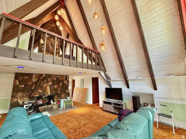 12498 East Wilderness Road Brighton, UT 84121 - Photo 23 of 40 Vaulted ceiling living space featuring exposed wood beams and white paneled ceiling