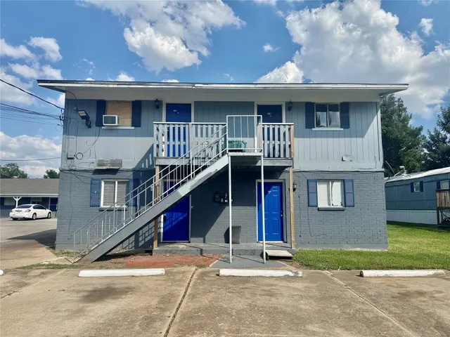 a front view of house with an outdoor space