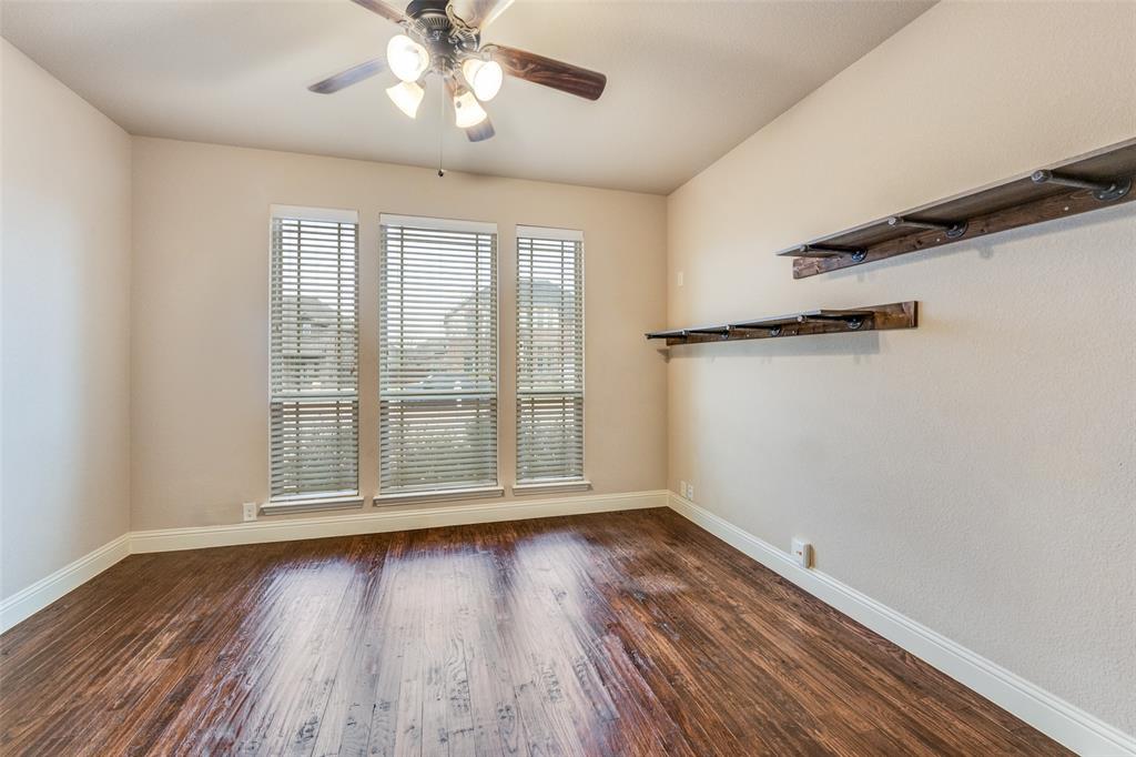 1137 Cardinal Ridge Road Burleson, TX 76028 - Photo 16 of 28 wooden floor in an empty room with a window