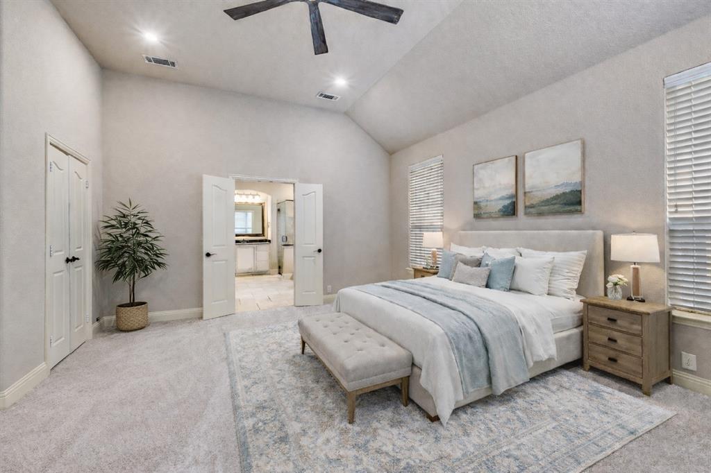 1137 Cardinal Ridge Road Burleson, TX 76028 - Photo 20 of 28 a spacious bedroom with a large bed and a potted plant