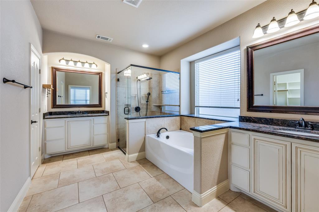 1137 Cardinal Ridge Road Burleson, TX 76028 - Photo 22 of 28 a bathroom with a tub a sink and mirror
