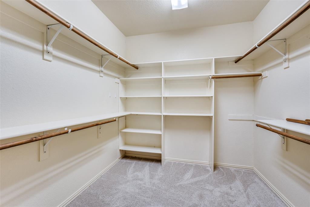 1137 Cardinal Ridge Road Burleson, TX 76028 - Photo 24 of 28 a view of walk in closet with empty racks