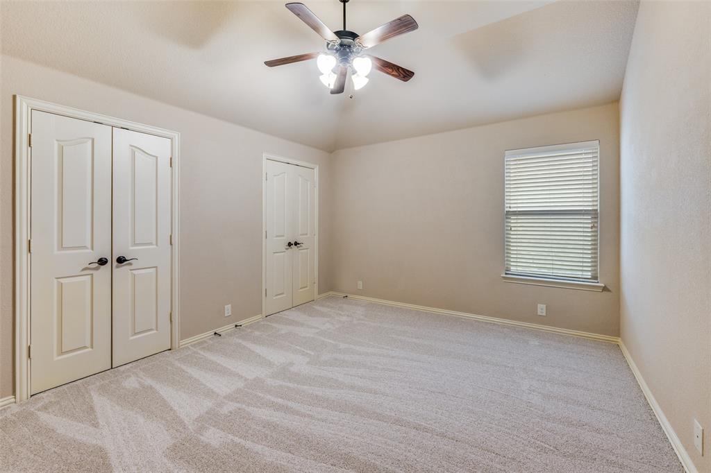 1137 Cardinal Ridge Road Burleson, TX 76028 - Photo 26 of 28 a view of an empty room and a ceiling fan