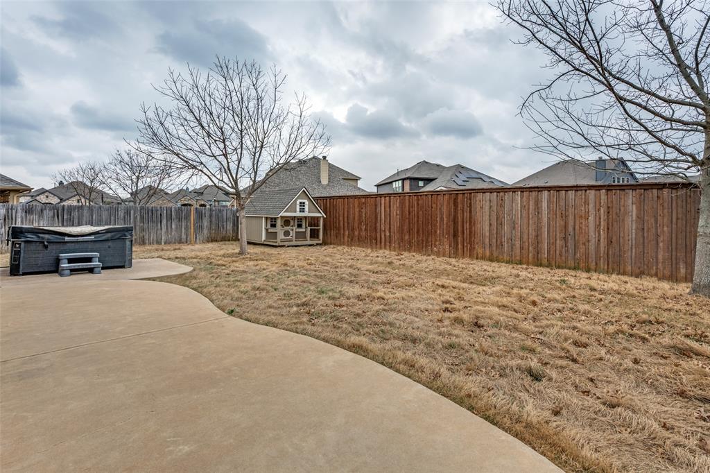 1137 Cardinal Ridge Road Burleson, TX 76028 - Photo 28 of 28 a view of a yard with a large tree