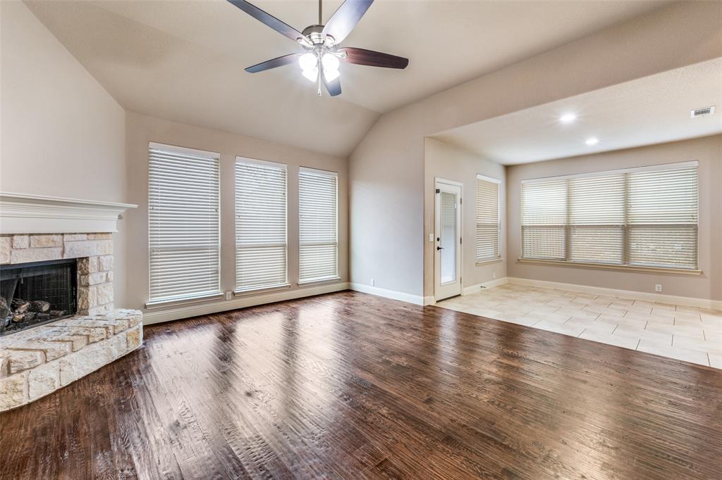 1137 Cardinal Ridge Road Burleson, TX 76028 - Photo 4 of 28 a view of an empty room with wooden floor and a window