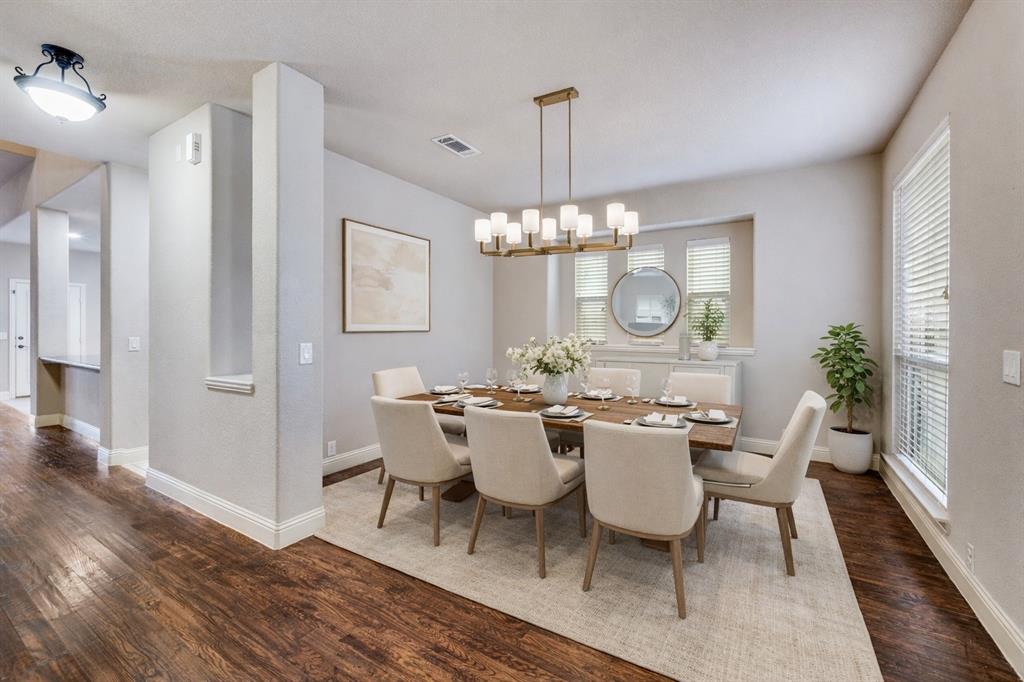 1137 Cardinal Ridge Road Burleson, TX 76028 - Photo 5 of 28 a view of a dining room with furniture a chandelier and wooden floor