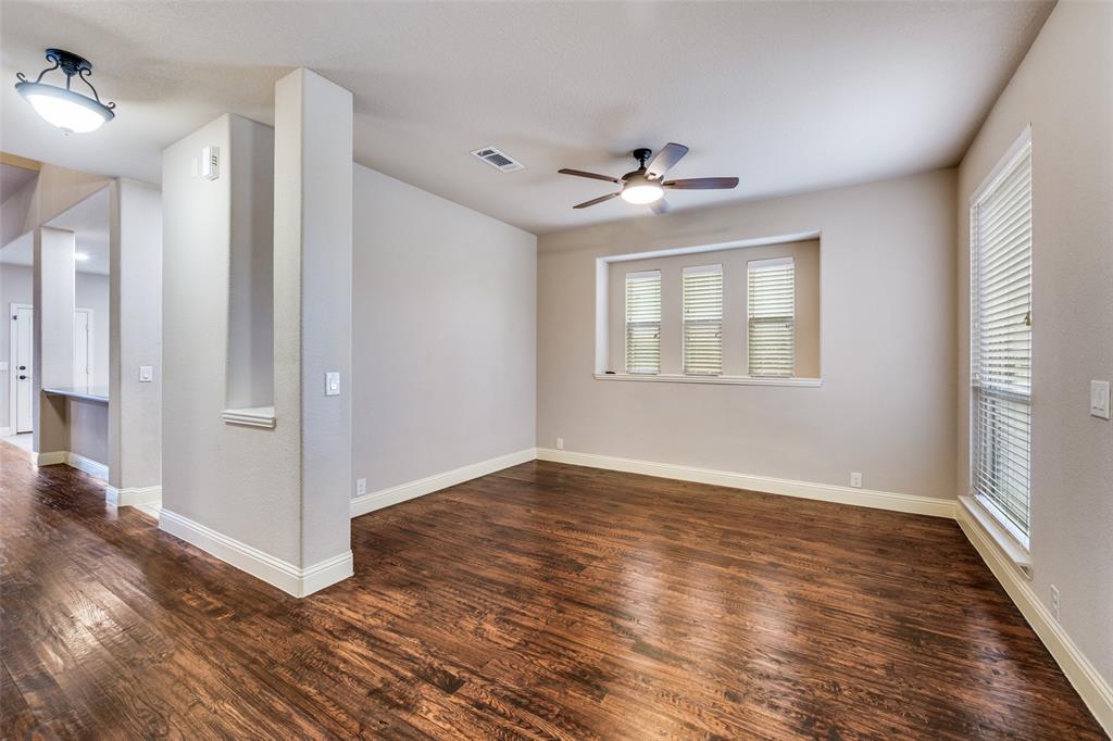 1137 Cardinal Ridge Road Burleson, TX 76028 - Photo 6 of 28 wooden floor in an empty room with a window