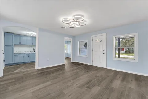 a view of an empty room with a window