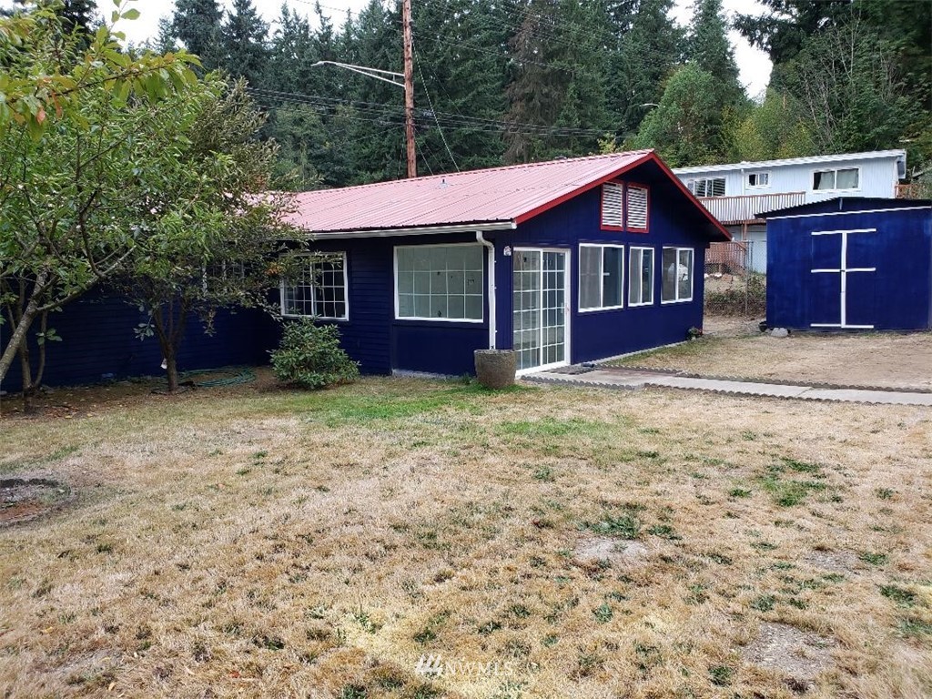 217 228th Street Southeast Bothell, WA 98021 - Photo 2 of 20 a front view of a house with garden