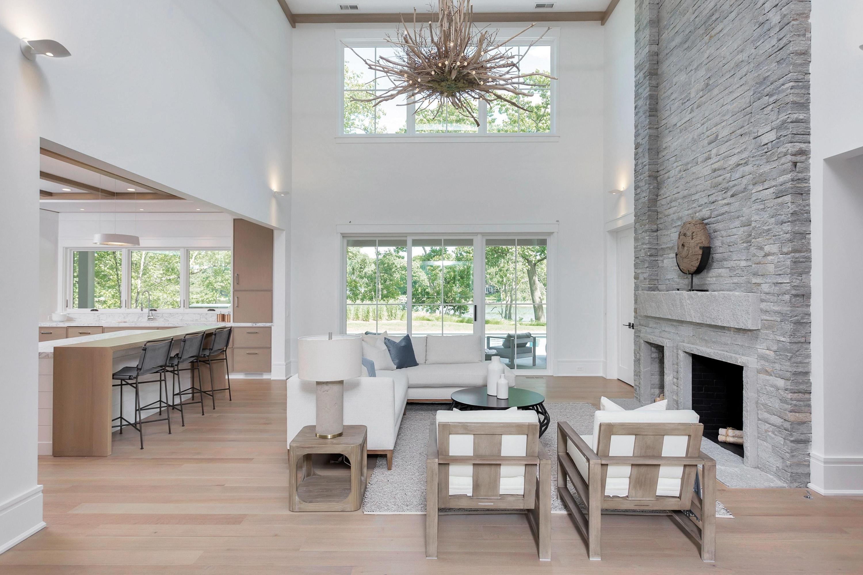 17 Brush Island Road Darien, CT 06820 - Photo 13 of 34 a living room with furniture a fireplace and a large window