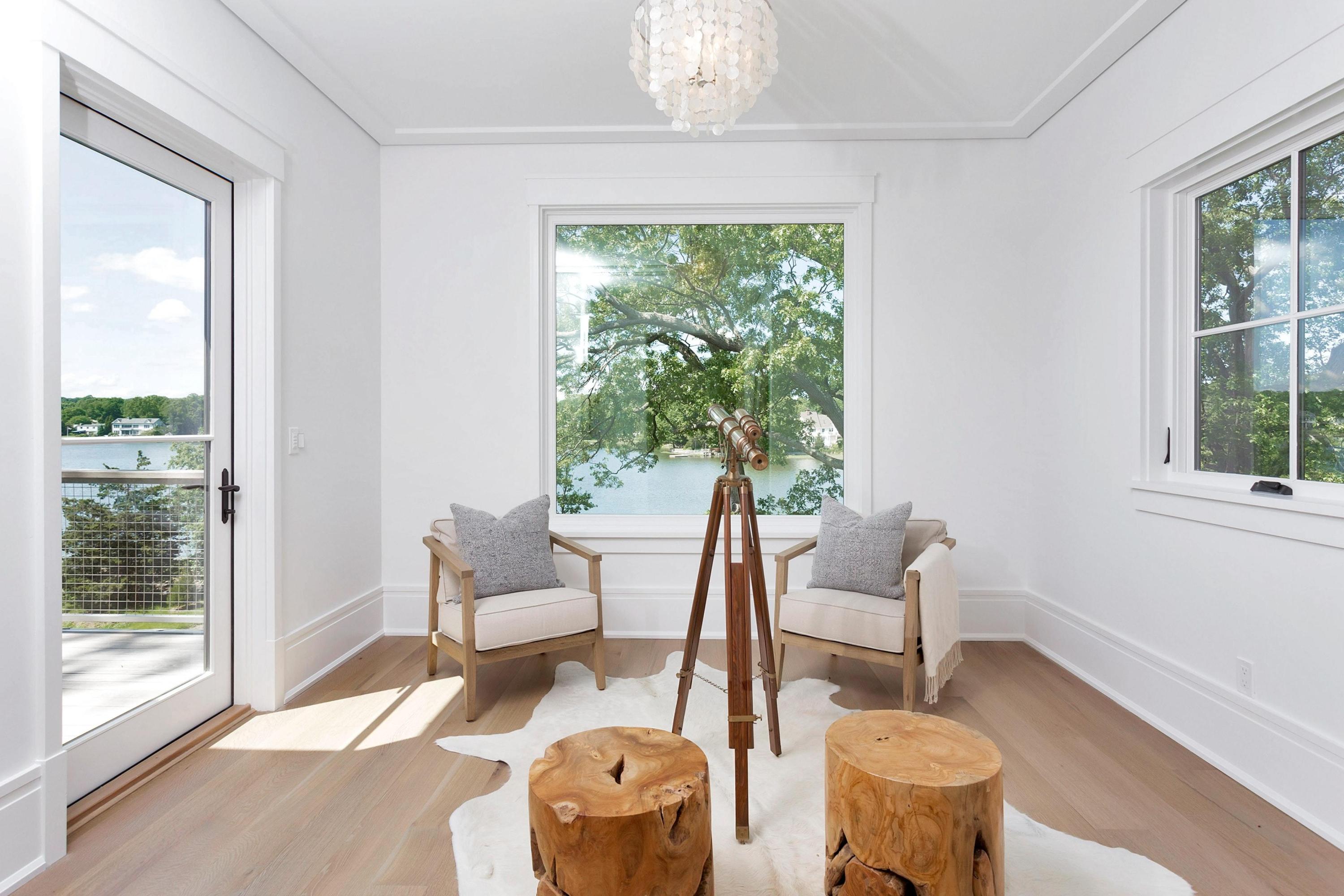 17 Brush Island Road Darien, CT 06820 - Photo 16 of 34 a living room with patio furniture and a large window