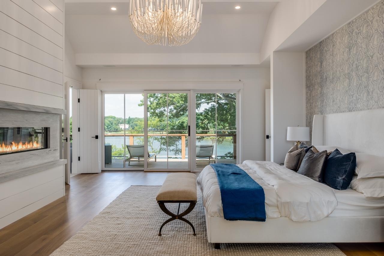 17 Brush Island Road Darien, CT 06820 - Photo 17 of 34 a bedroom with a bed and a large window