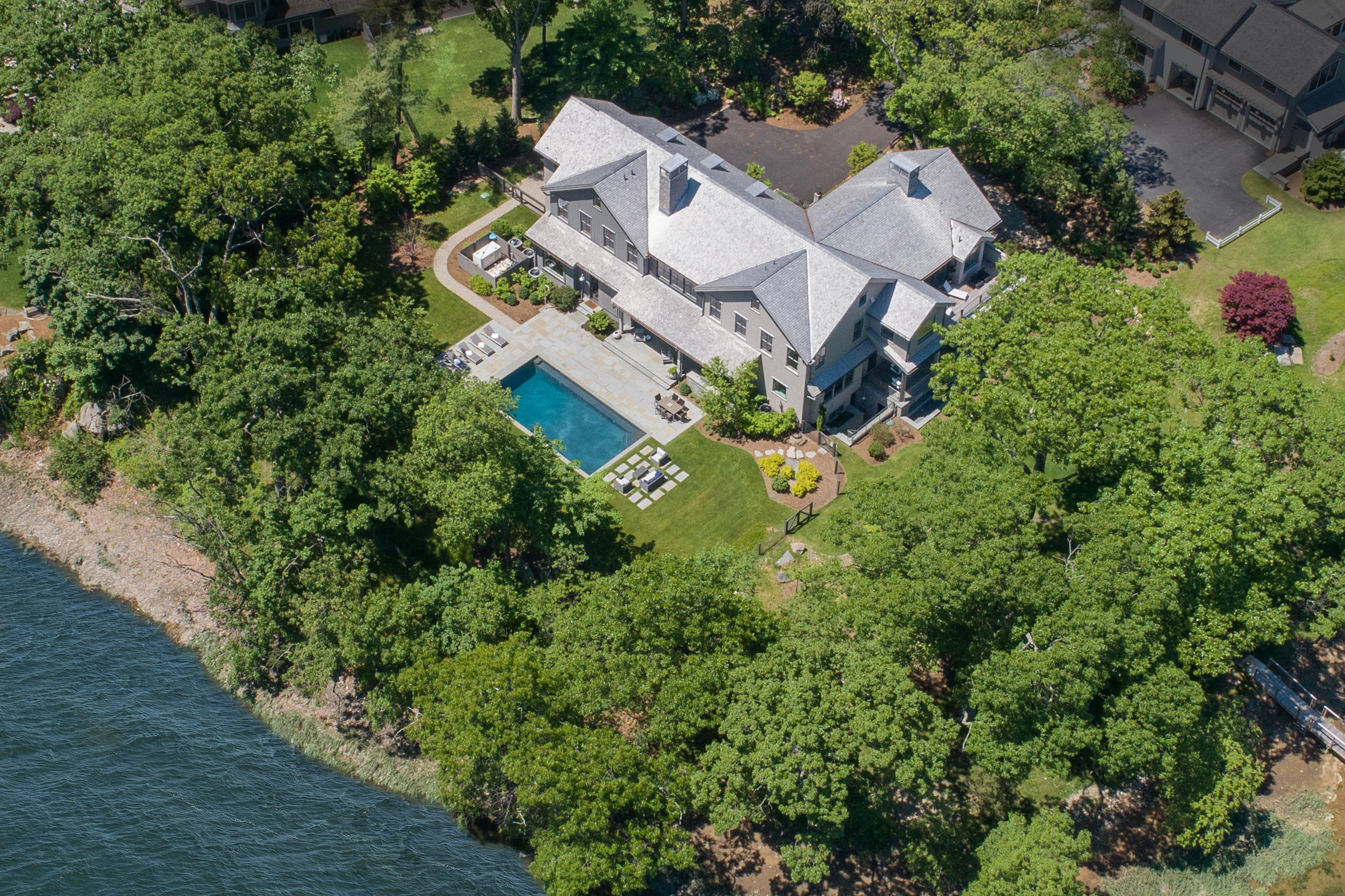 17 Brush Island Road Darien, CT 06820 - Photo 2 of 34 an aerial view of a house with a yard and garden