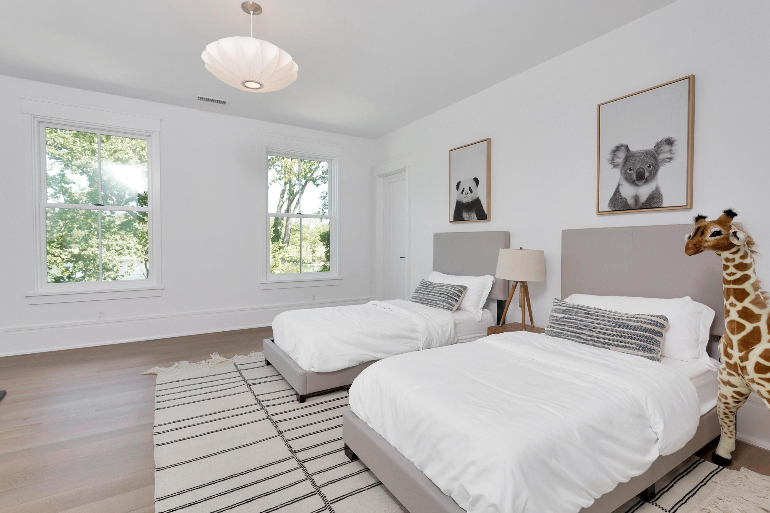 17 Brush Island Road Darien, CT 06820 - Photo 23 of 34 a bedroom with two beds and a window