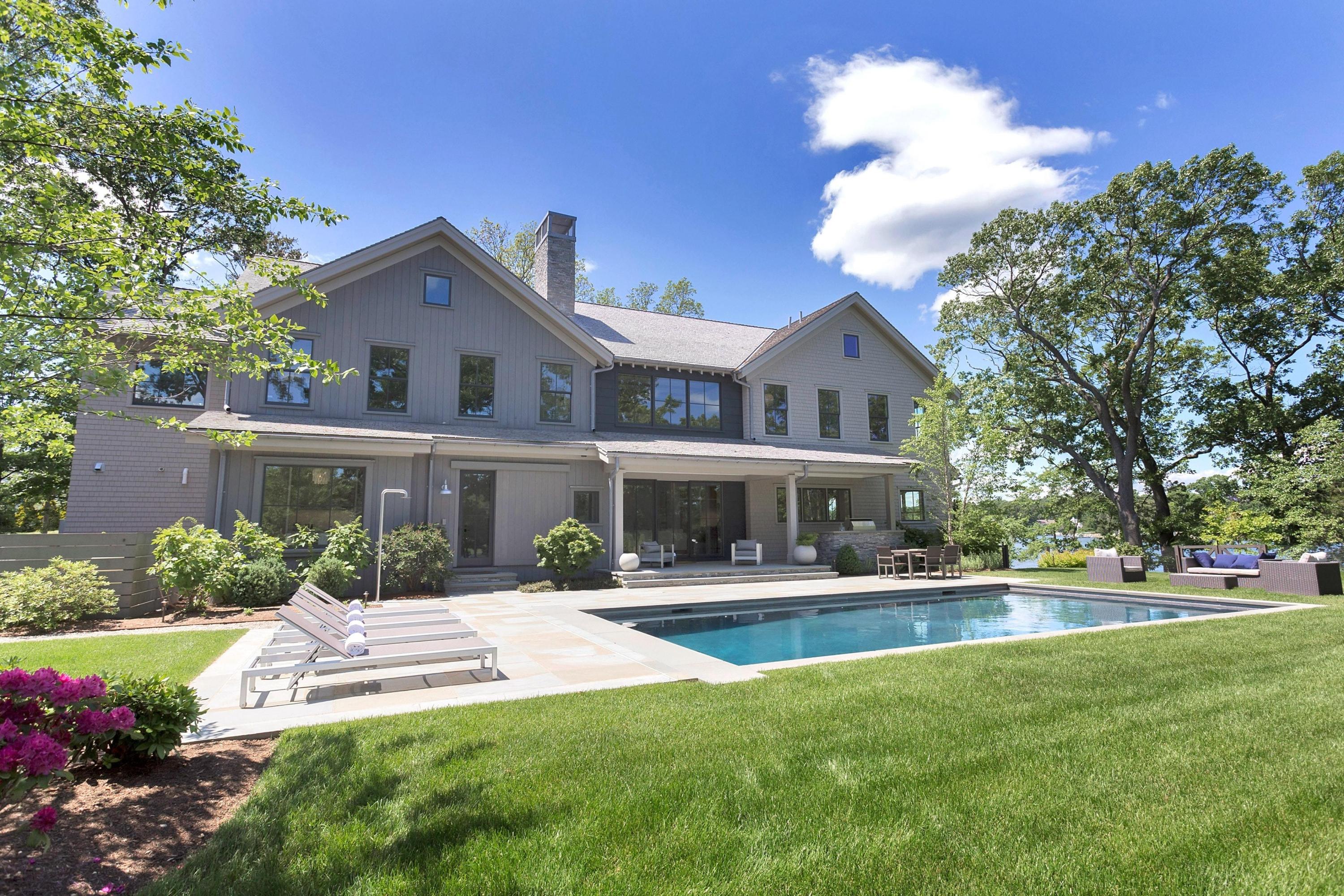 17 Brush Island Road Darien, CT 06820 - Photo 27 of 34 a front view of a house with a yard