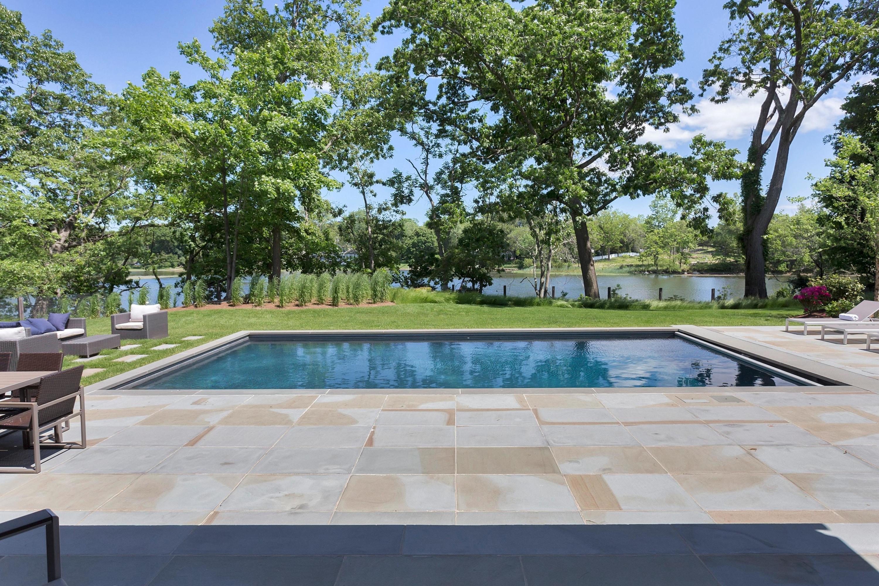 17 Brush Island Road Darien, CT 06820 - Photo 33 of 34 a view of a swimming pool with a yard
