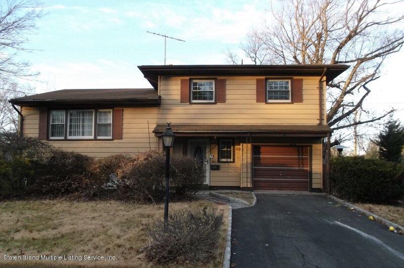 1 Sarno Street Colonia, NJ 07067 - Photo 1 of 30 a front view of a house with a yard