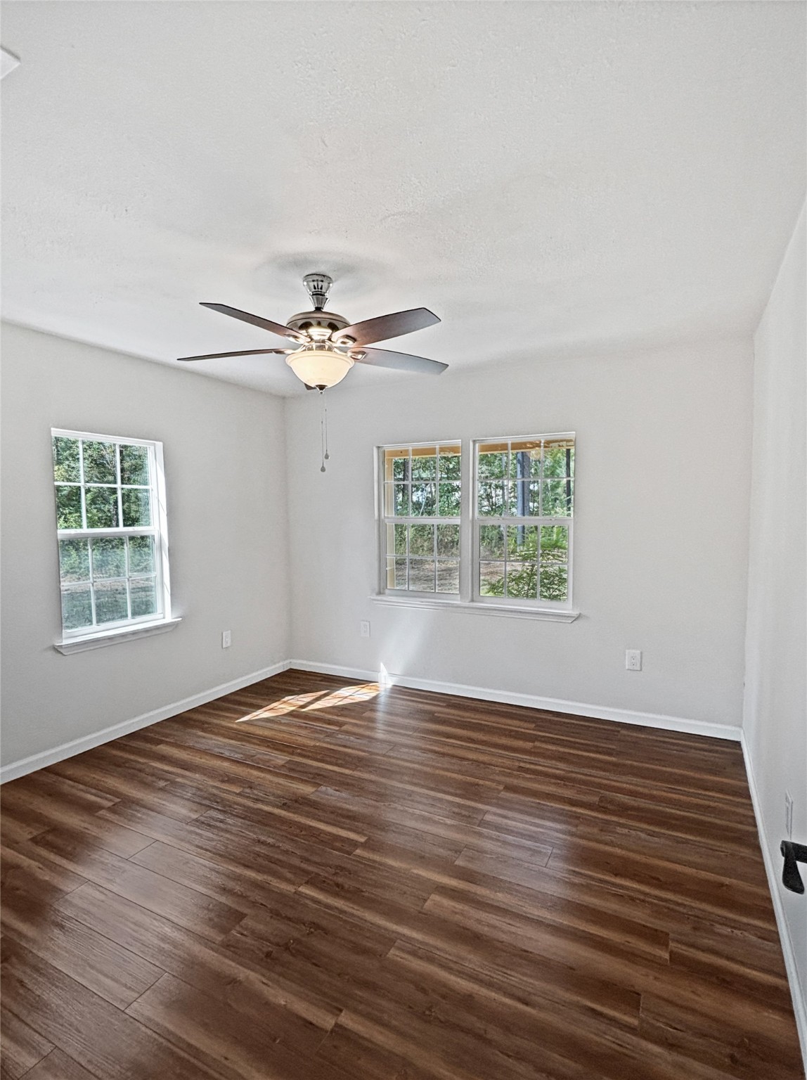 5680 Fm 252 Jasper, TX 75951 - Photo 13 of 23 a view of an empty room with wooden floor and a window