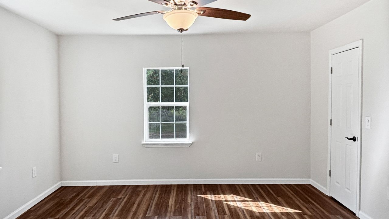 5680 Fm 252 Jasper, TX 75951 - Photo 14 of 23 an empty room with chandelier fan