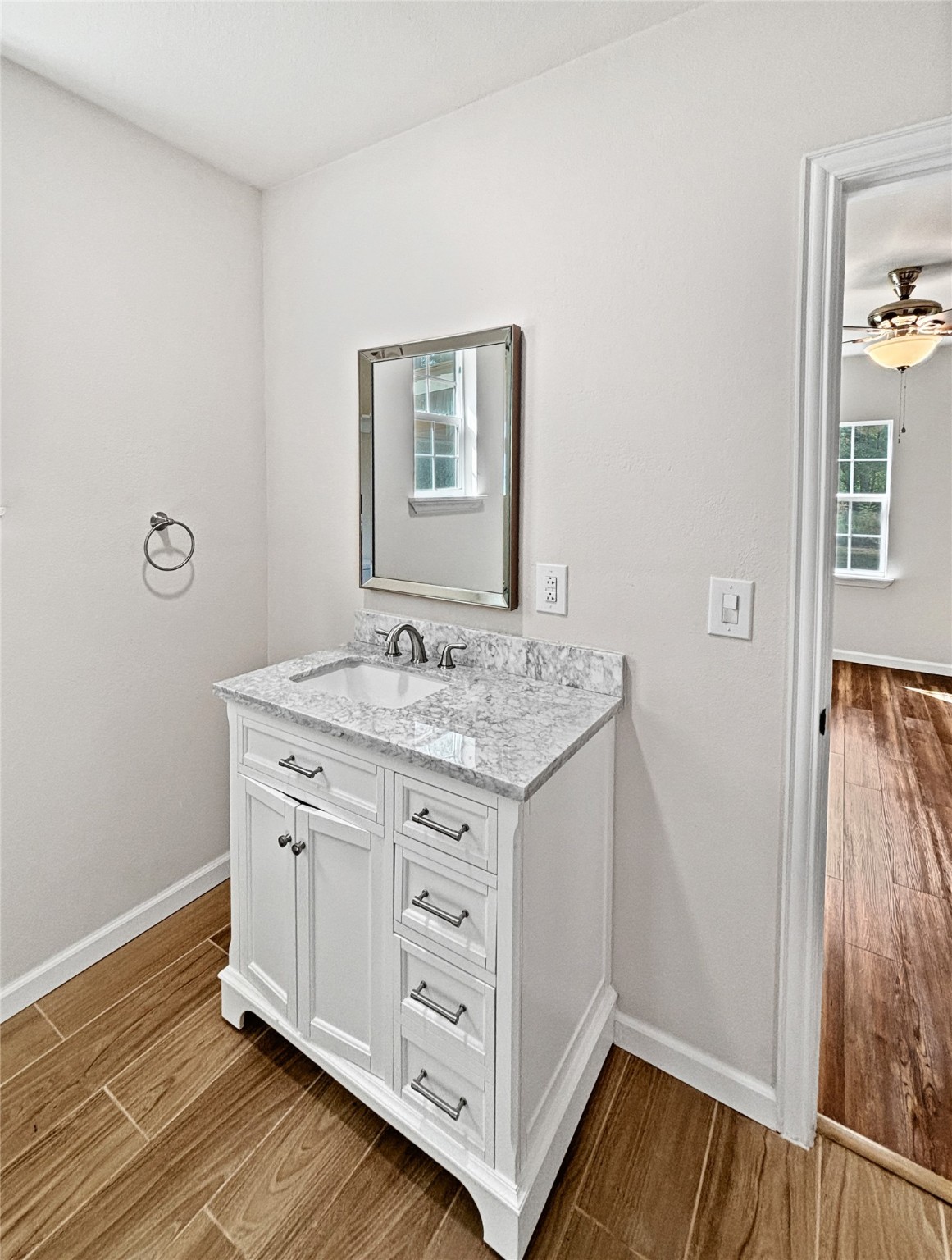 5680 Fm 252 Jasper, TX 75951 - Photo 9 of 23 a bathroom with a granite countertop sink and a mirror