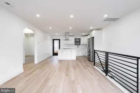 a view of a kitchen with wooden floor