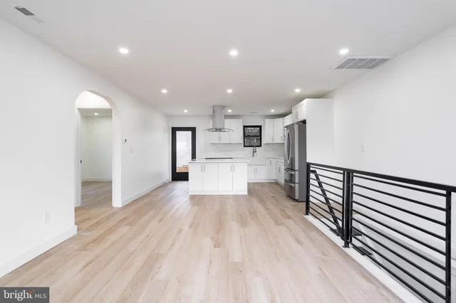 a view of a kitchen with wooden floor