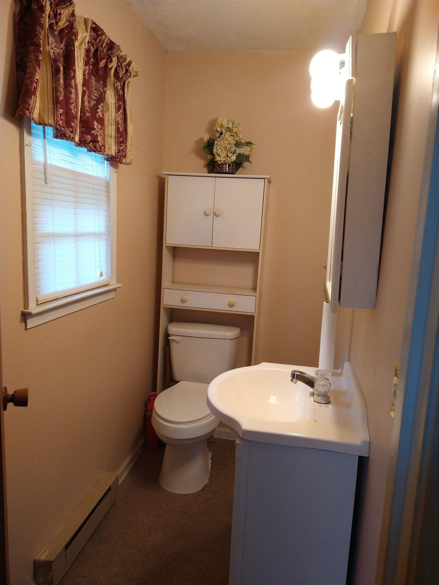 381 Friendship Church Road Middlesex, NC 27557 - Photo 14 of 19 a bathroom with a toilet sink and mirror