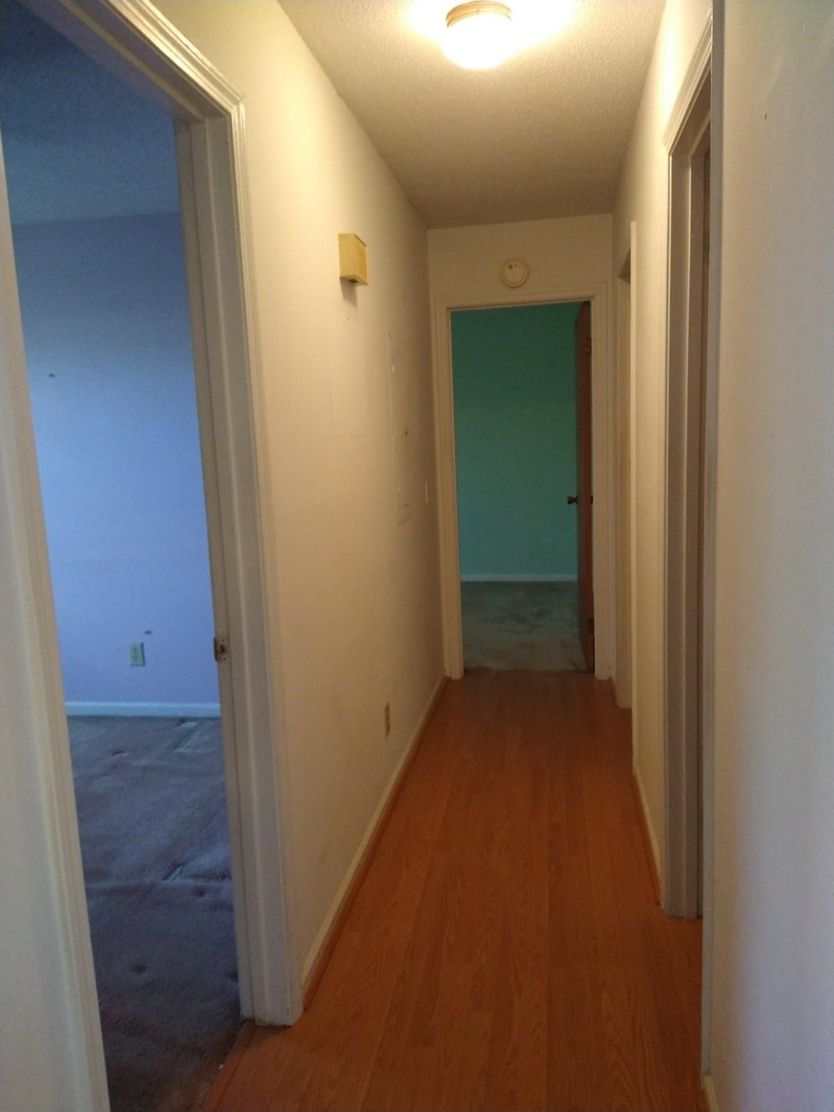 381 Friendship Church Road Middlesex, NC 27557 - Photo 6 of 19 a view of a hallway with wooden floor