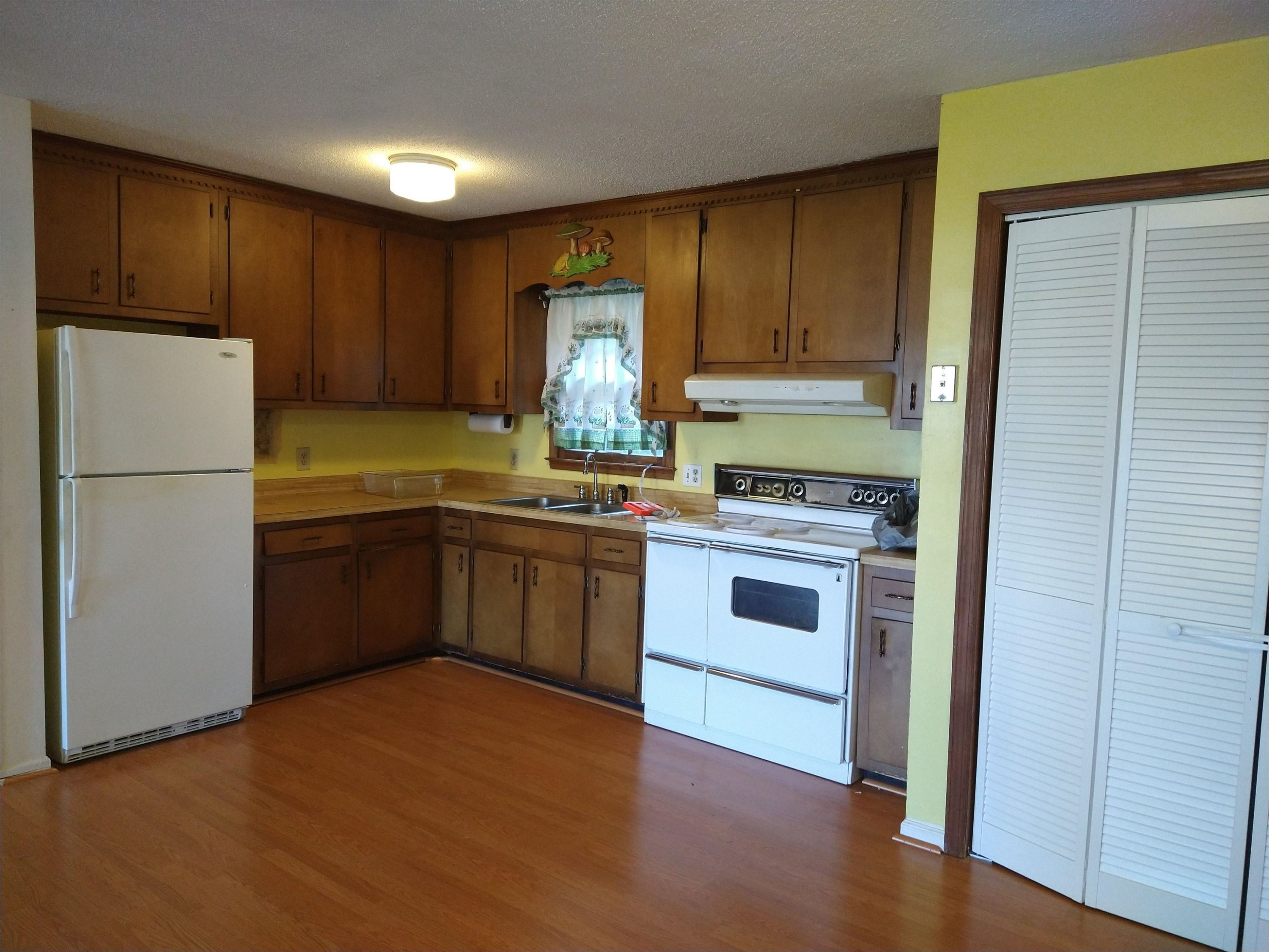 381 Friendship Church Road Middlesex, NC 27557 - Photo 9 of 19 a kitchen with a stove a refrigerator and a sink