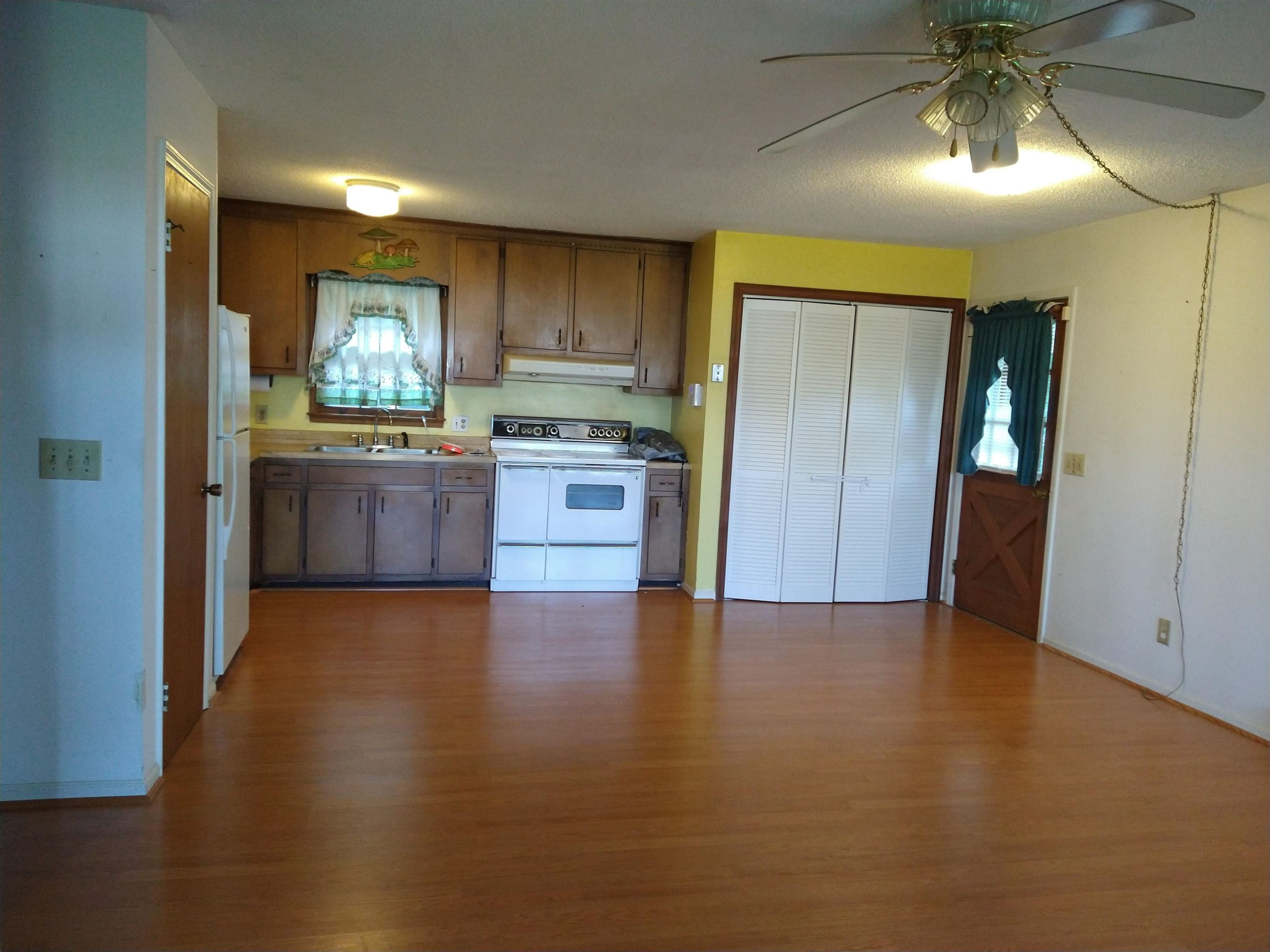381 Friendship Church Road Middlesex, NC 27557 - Photo 10 of 19 a view of a kitchen with a sink and a refrigerator