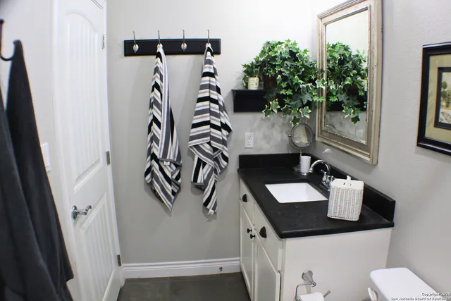 a bathroom with a sink and mirror
