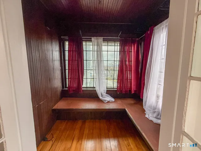 a view of front door with wooden floor