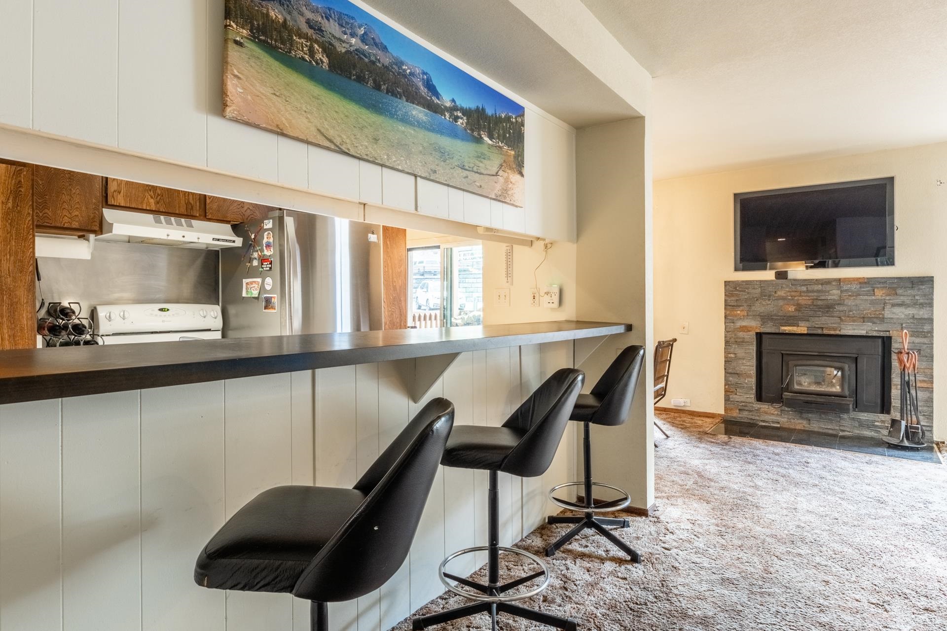 25 Lee Road, Unit 161 Mammoth Lakes, CA 93546 - Photo 11 of 43 a dining room with furniture and a fireplace