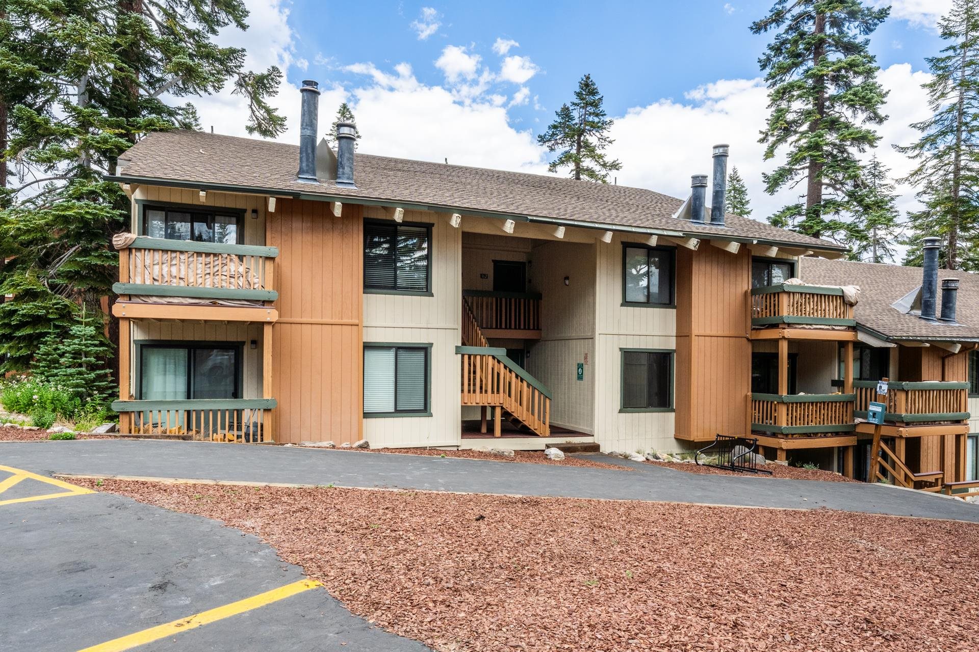 25 Lee Road, Unit 161 Mammoth Lakes, CA 93546 - Photo 30 of 43 a view of a white house with large windows