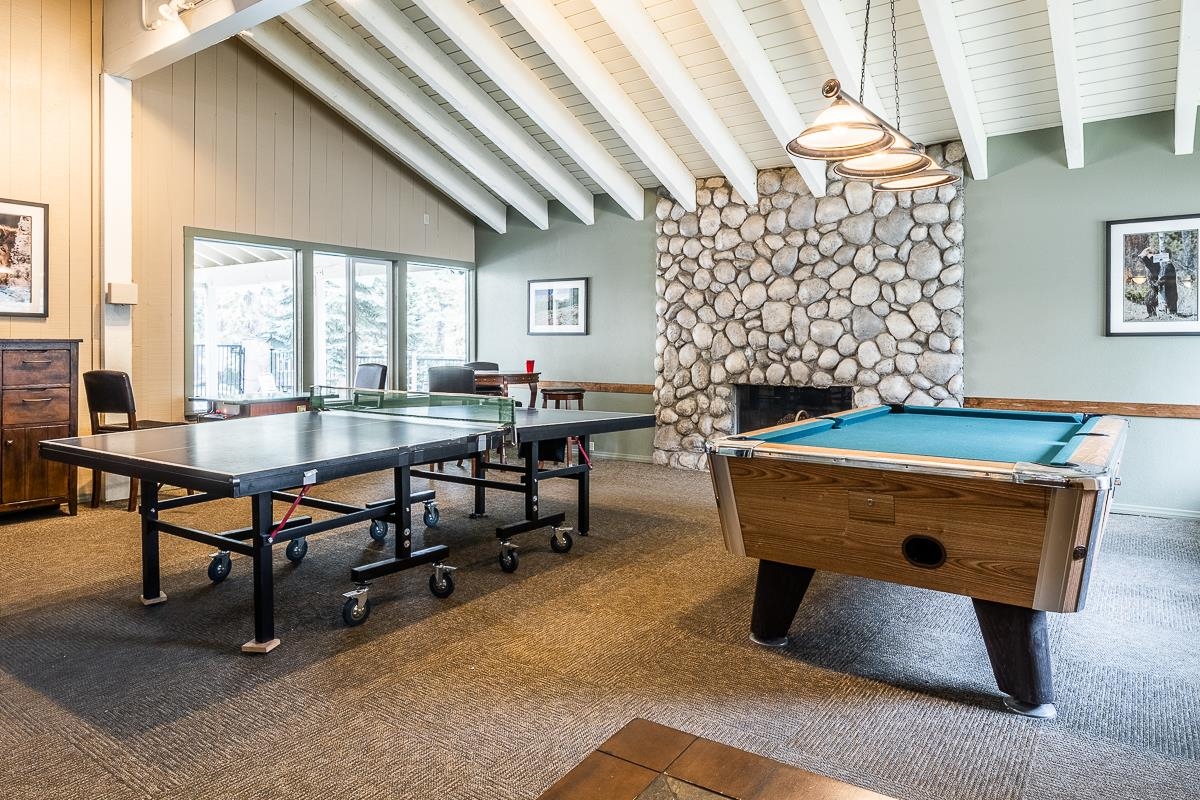 25 Lee Road, Unit 161 Mammoth Lakes, CA 93546 - Photo 35 of 43 a living room with furniture a table and a fireplace