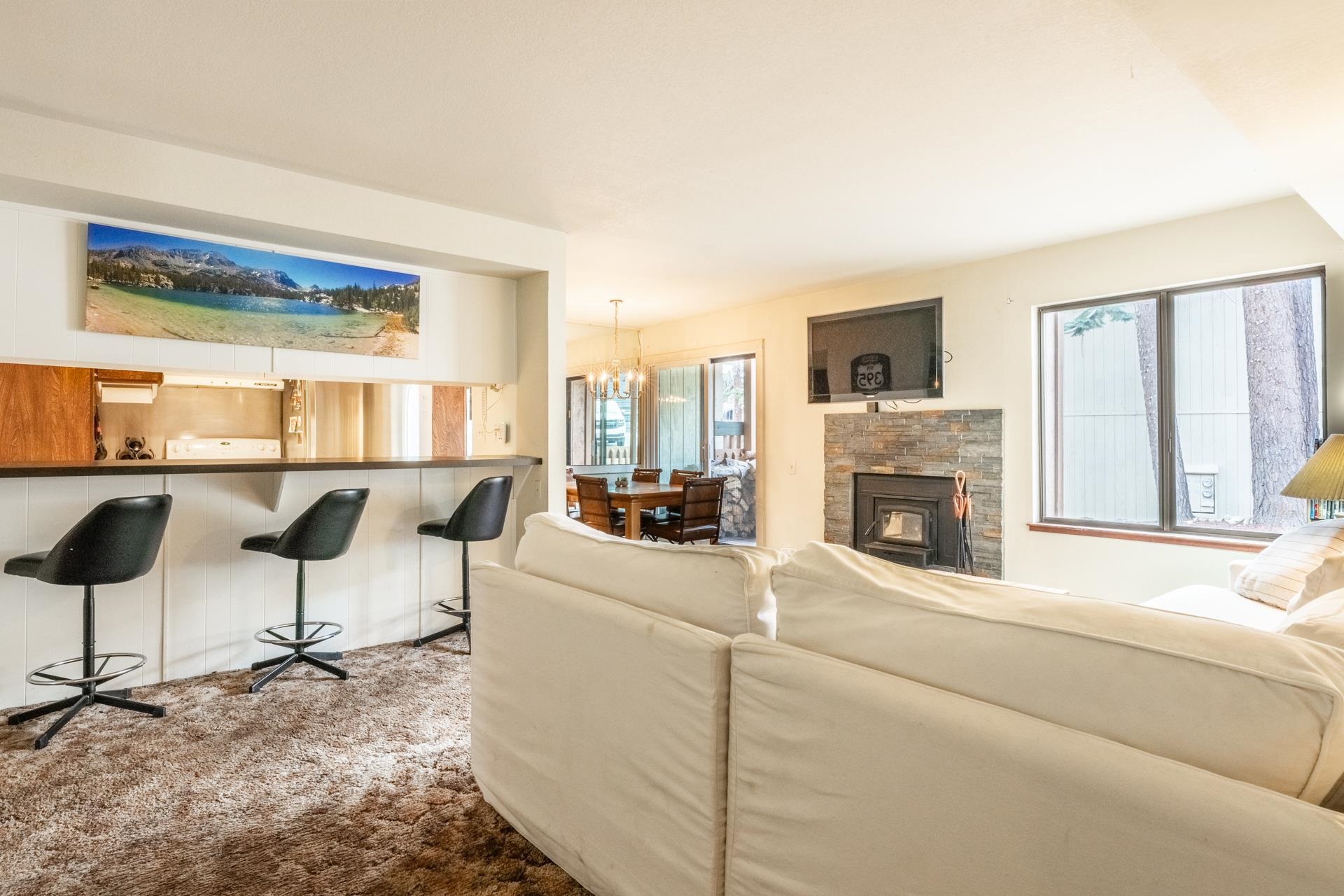 25 Lee Road, Unit 161 Mammoth Lakes, CA 93546 - Photo 5 of 43 a living room with furniture and a fireplace
