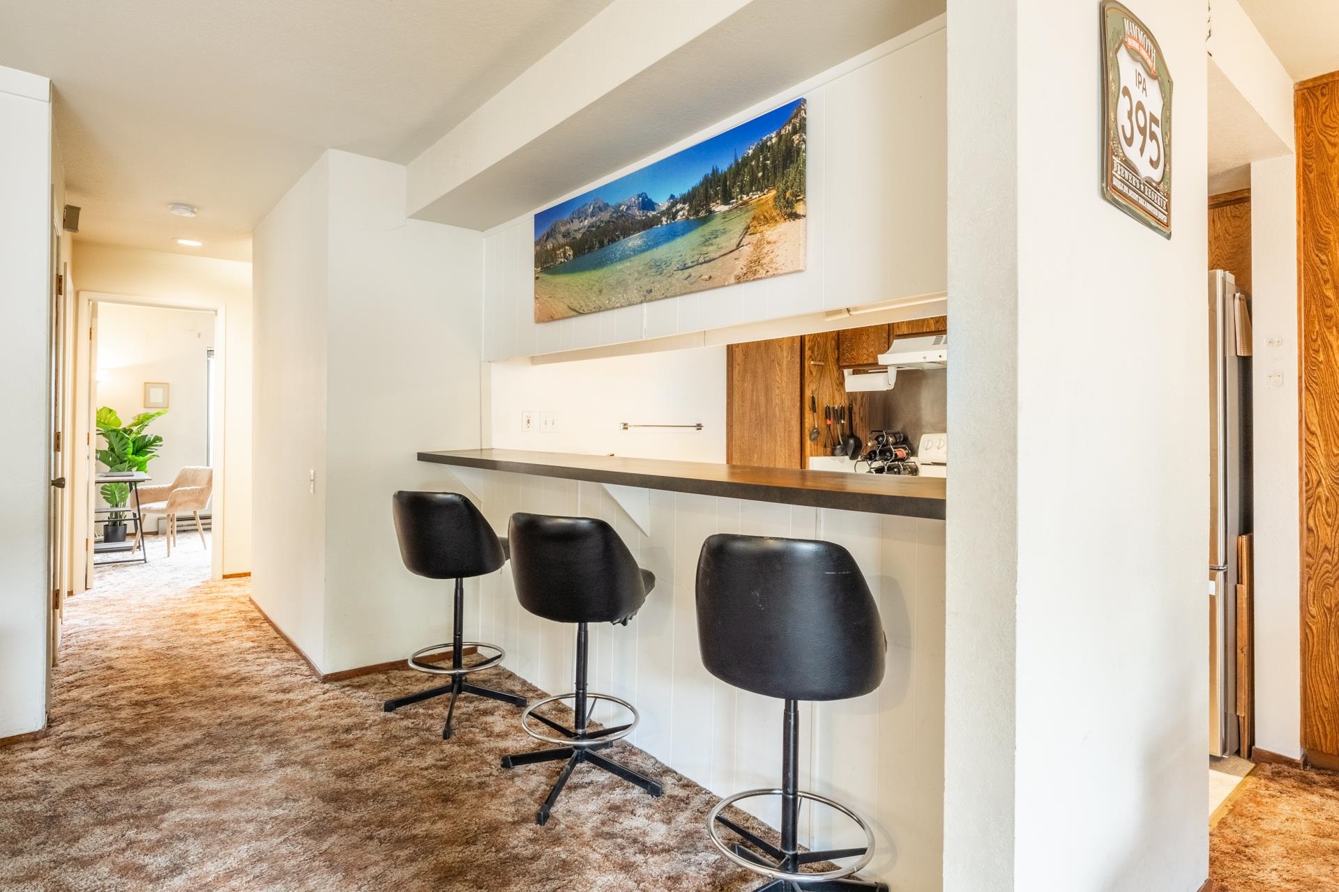 25 Lee Road, Unit 161 Mammoth Lakes, CA 93546 - Photo 10 of 43 a kitchen with dining area and glass windows