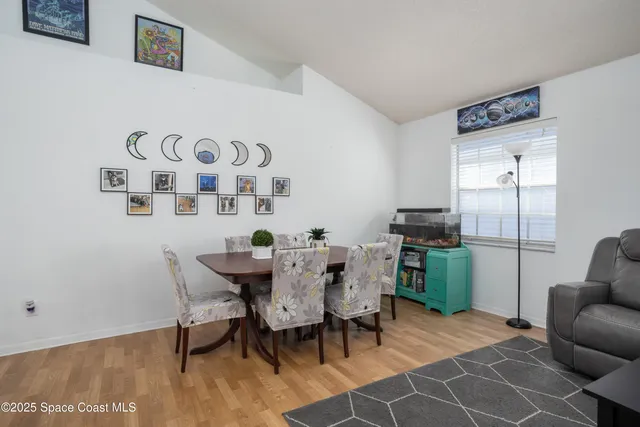 a view of a livingroom with furniture and wooden floor