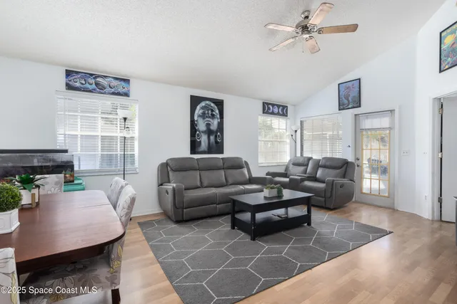 a living room with furniture and a window