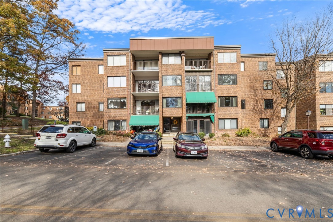 a car parked in front of a brick building