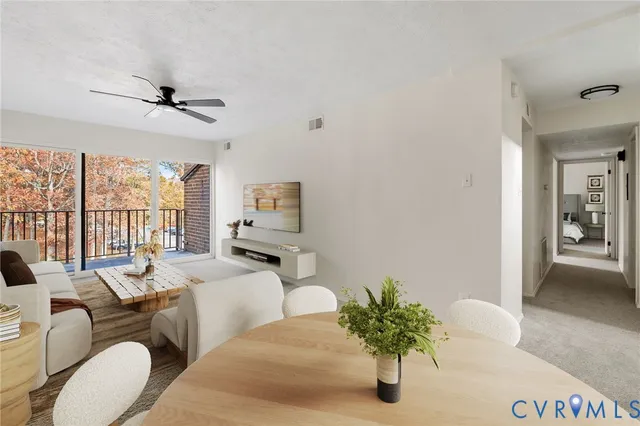 a bedroom with furniture and a large window