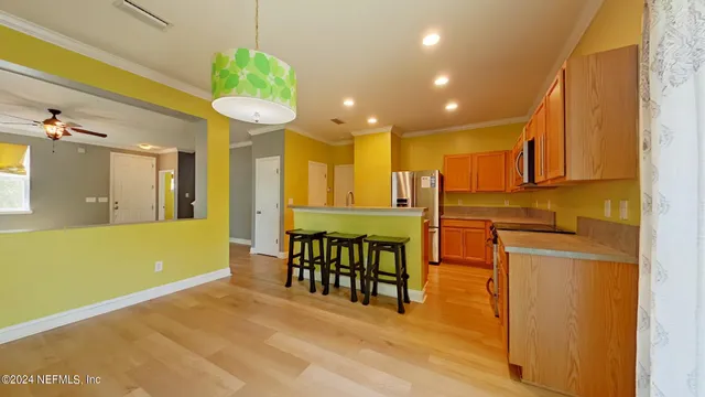 a view of a kitchen with dining area