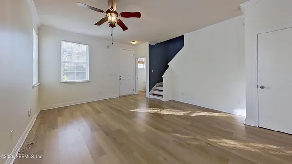 a view of empty room with windows