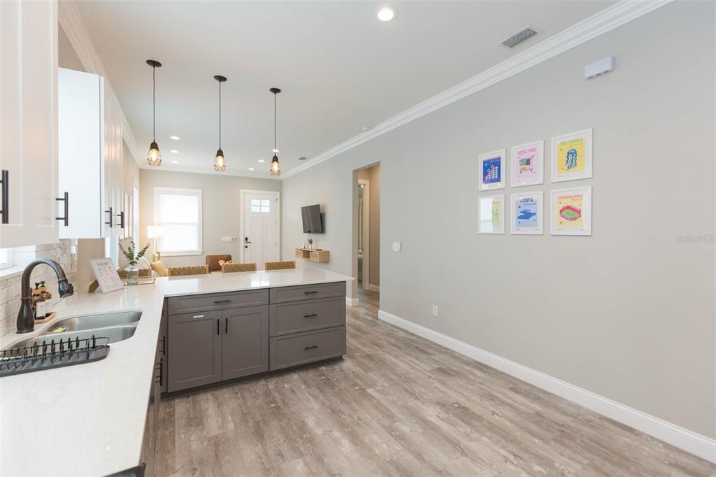 2901 N Boulevard Tampa, FL 33602 - Photo 17 of 63 a large white kitchen with kitchen island a sink stainless steel appliances and cabinets