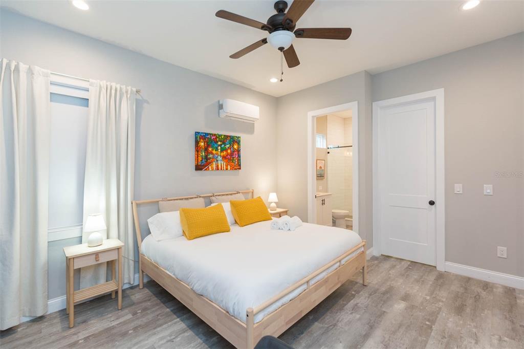 2901 N Boulevard Tampa, FL 33602 - Photo 58 of 63 a bedroom with a bed and wooden floor