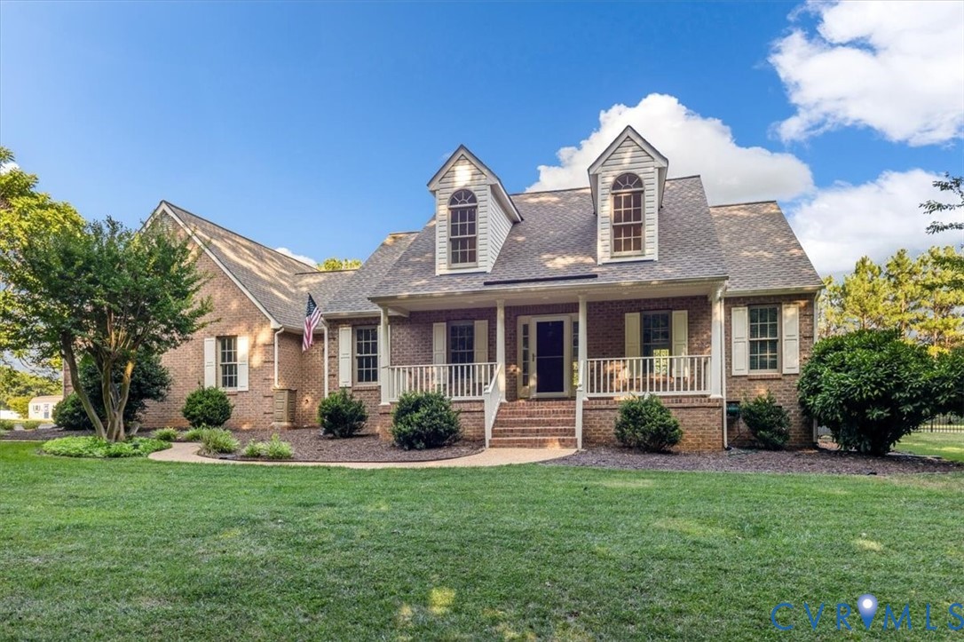 1437 Palmore Road Powhatan, VA 23139 - Photo 1 of 60 Traditional brick exterior featuring a covered fro